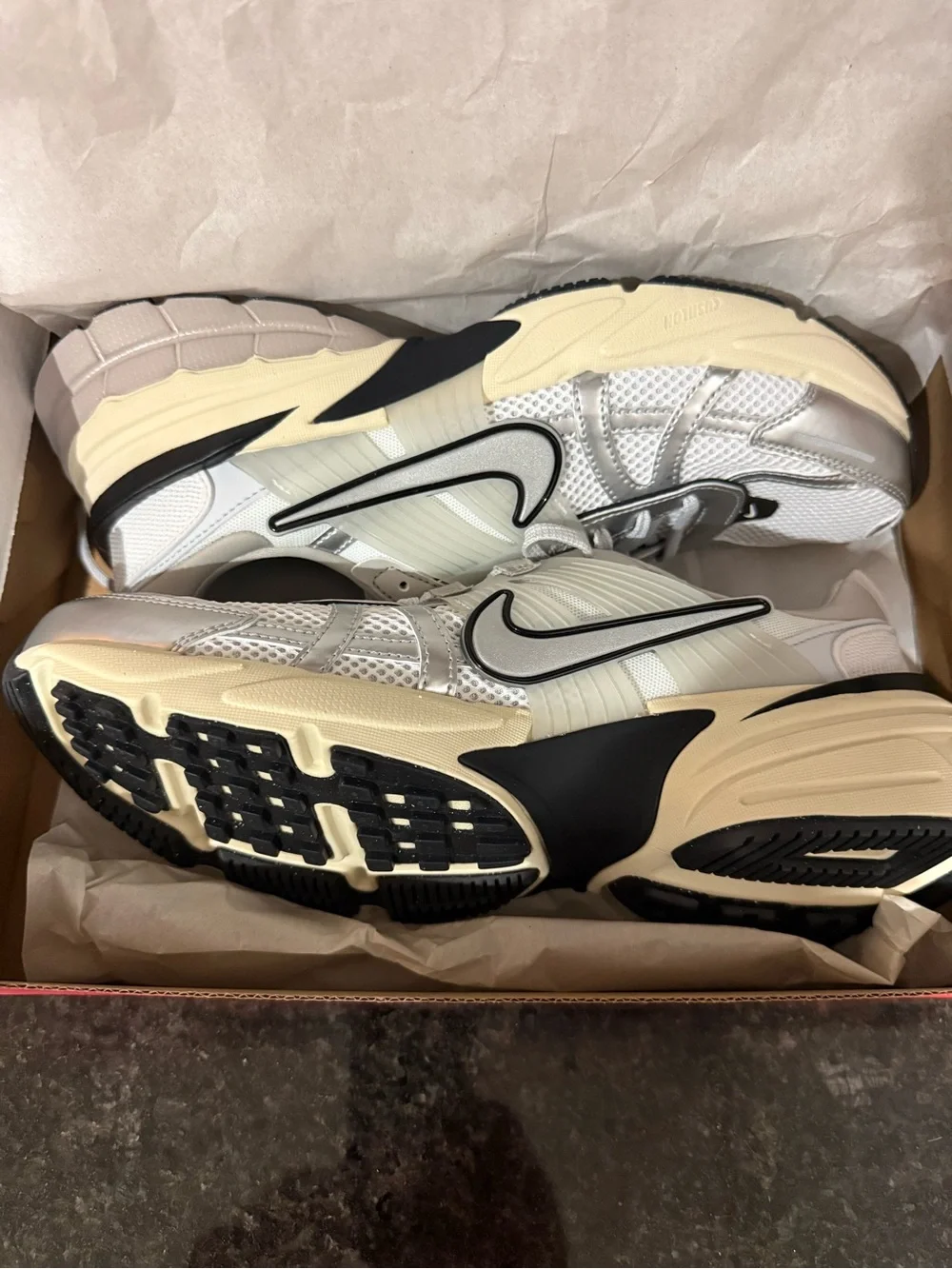 Size 11 Women’s or 9.5 Men’s Nike Silver and Cream Mesh Running Sneakers
